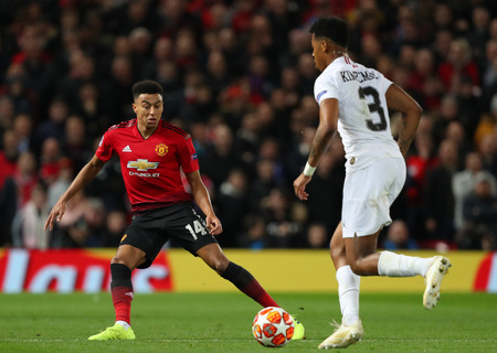 MANCHESTER, ENGLAND - FEBRUARY 12 2019: Jesse Lingard of Manchester United and Presnel Kimpembe of PSG during the Champions League match between Manchester United and Paris Saint-Germain at Old Trafford Stadium.のeditorial素材