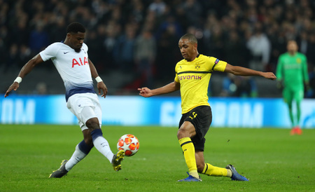 LONDON, ENGLAND - FEBRUARY 13 2019: Serge Aurier of Tottenham and Abdou Diallo of Dortmund during the Champions League match between Tottenham Hotspur and Borussia Dortmund at Wembley Stadium, London.のeditorial素材