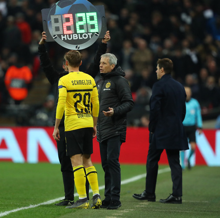 LONDON, ENGLAND - FEBRUARY 13 2019: Marcel Schmelzer of Dortmund and manager Lucien Favre during the Champions League match between Tottenham Hotspur and Borussia Dortmund at Wembley Stadium, London.のeditorial素材