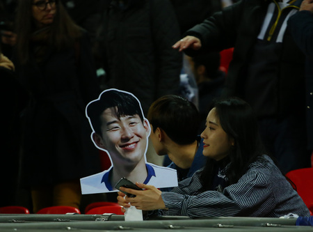 LONDON, ENGLAND - FEBRUARY 13 2019: Fans with a cardboard cut-out of Son Heung-Min of Tottenham during the Champions League match between Tottenham Hotspur and Borussia Dortmund at Wembley Stadium, London.のeditorial素材