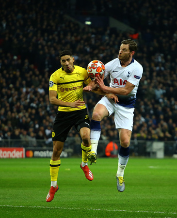 LONDON, ENGLAND - FEBRUARY 13 2019: Achraf Hakimi of Dortmund and Jan Vertonghen of Tottenham during the Champions League match between Tottenham Hotspur and Borussia Dortmund at Wembley Stadium, London.のeditorial素材