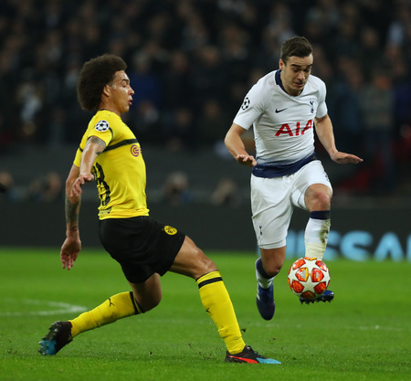 LONDON, ENGLAND - FEBRUARY 13 2019: Axel Witsel of Dortmund and Harry Winks of Tottenham compete for the ball during the Champions League match between Tottenham Hotspur and Borussia Dortmund at Wembley Stadium, London.のeditorial素材