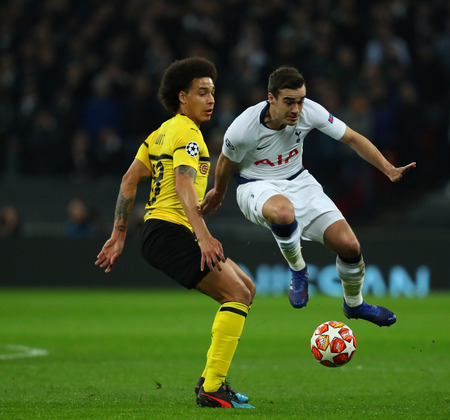 LONDON, ENGLAND - FEBRUARY 13 2019: Axel Witsel of Dortmund and Harry Winks of Tottenham compete for the ball during the Champions League match between Tottenham Hotspur and Borussia Dortmund at Wembley Stadium, London.のeditorial素材