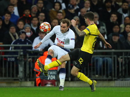 LONDON, ENGLAND - FEBRUARY 13 2019: Christian Eriksen of Tottenham and Christian Pulisic of Dortmund during the Champions League match between Tottenham Hotspur and Borussia Dortmund at Wembley Stadium, London.のeditorial素材