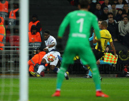 LONDON, ENGLAND - FEBRUARY 13 2019: Serge Aurier of Tottenham crosses the ball during the Champions League match between Tottenham Hotspur and Borussia Dortmund at Wembley Stadium, London.のeditorial素材