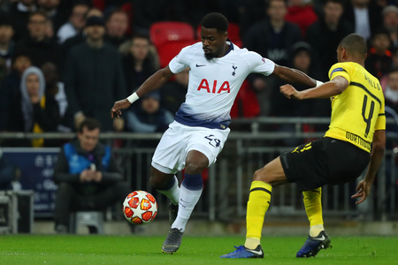 LONDON, ENGLAND - FEBRUARY 13 2019: Serge Aurier of Tottenham and Abdou Diallo of Dortmund during the Champions League match between Tottenham Hotspur and Borussia Dortmund at Wembley Stadium, London.のeditorial素材