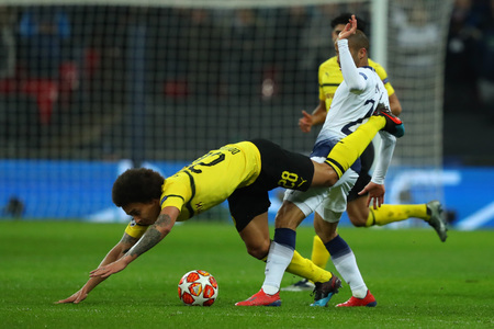 LONDON, ENGLAND - FEBRUARY 13 2019: Axel Witsel of Dortmund and Lucas of Tottenham during the Champions League match between Tottenham Hotspur and Borussia Dortmund at Wembley Stadium, London.のeditorial素材
