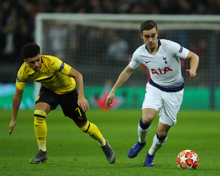LONDON, ENGLAND - FEBRUARY 13 2019: Jadon Sancho of Dortmund and Harry Winks of Tottenham during the Champions League match between Tottenham Hotspur and Borussia Dortmund at Wembley Stadium, London.のeditorial素材
