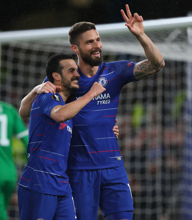 LONDON, ENGLAND - MARCH 7 2019: Pedro of Chelsea celebrates scoring a goal with Olivier Giroud during the Europa League match between Chelsea and Dynamo Kyiv at Stamford Bridge.のeditorial素材
