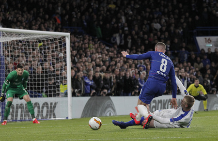 LONDON, ENGLAND - MARCH 7 2019: Ross Barkley of Chelsea is tackled by Mykyta Burda of Dynamo Kiev during the Europa League match between Chelsea and Dynamo Kyiv at Stamford Bridge.のeditorial素材