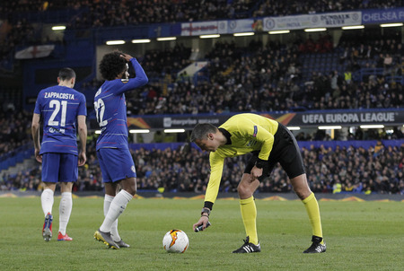 LONDON, ENGLAND - MARCH 7 2019: Referee Slavko Vincic spray marks the free kick spot during the Europa League match between Chelsea and Dynamo Kyiv at Stamford Bridge.のeditorial素材