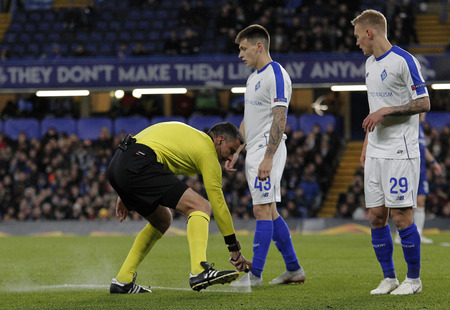 LONDON, ENGLAND - MARCH 7 2019: Referee Slavko Vincic spray marks the free kick defence line during the Europa League match between Chelsea and Dynamo Kyiv at Stamford Bridge.のeditorial素材