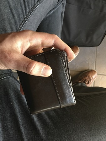Buying a new outfit, brown leather wallet and shoes.