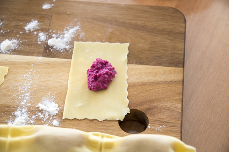a single pieces of dough filled with red berryの写真素材