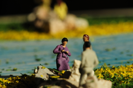 miniature photographer at the sea with female modelの写真素材