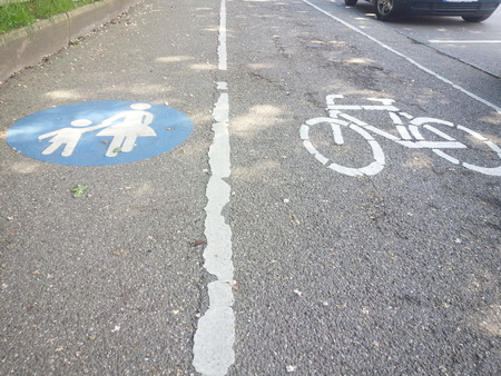 Signs for pedestrians and cyclists on the streetの写真素材