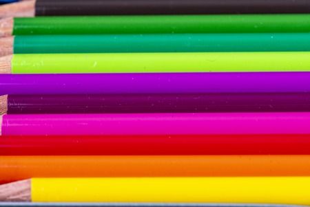 many colorful wooden pencils in very beautiful bright colors side by sideの写真素材
