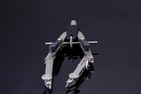 Compasses for school on black backgroundの写真素材