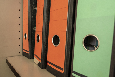 folders in different colors with red and green backsの写真素材