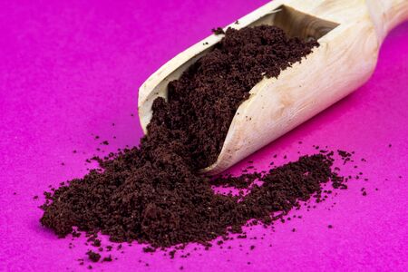 Coffee powder on pink background pure caffeineの写真素材