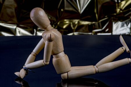 Wooden male Bound on the floorの写真素材