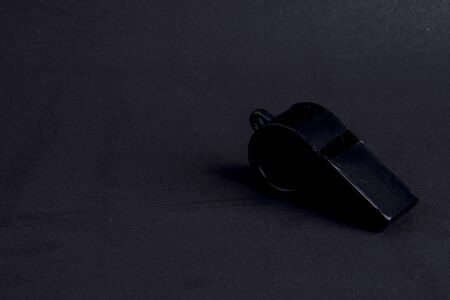 black whistle on black backgroundの写真素材