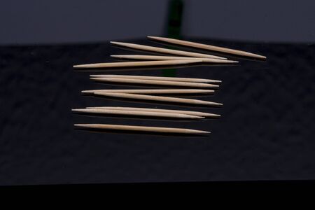 Toothpick mirrored on black base