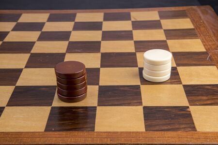 Checkers game with figures black and white