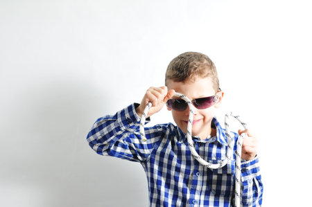 European child from the side looks into the camera with punchの写真素材