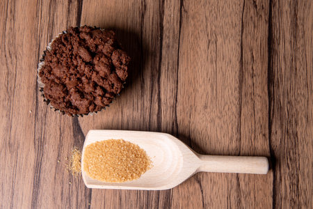 wooden spoon with brown sugarの写真素材