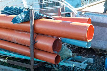 Plastic pipes with grooves on the construction siteの写真素材