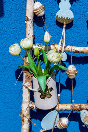 Church clock with pink steeple and blue skyの写真素材