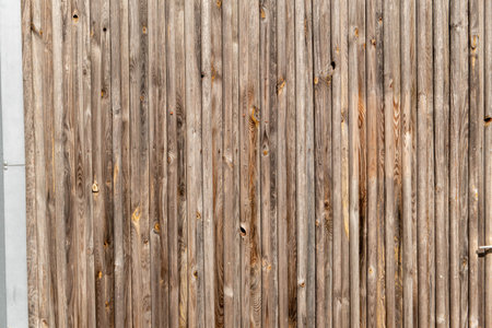 Pattern of wooden fence in the sun with uneven woodの写真素材