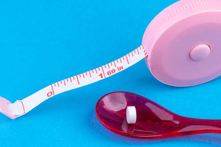 Tablet dosage box filled with nutritional supplementsの写真素材