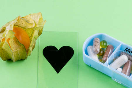 Tablet dosage box filled with nutritional supplementsの写真素材