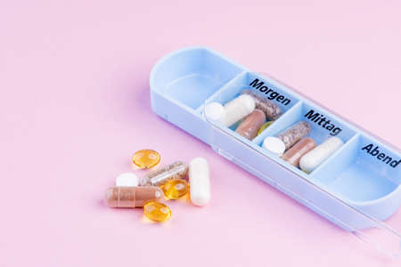 Tablet dosage box filled with nutritional supplementsの写真素材