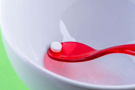 Clothes stacked in different colors in the wardrobeの写真素材