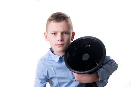 Child in blue shirt with guitar in portrait formatの写真素材