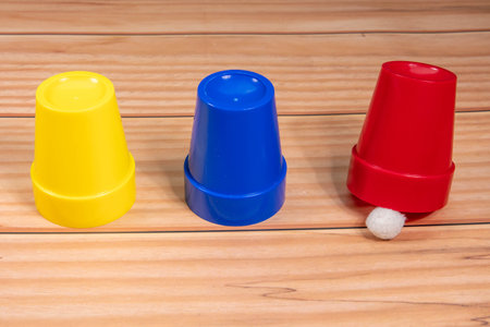 Colorful plastic caps on a wooden background, closeup of photoの写真素材