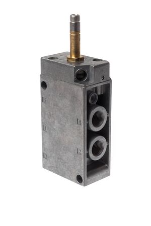 Steel alloy pneumatic solenoid 5/2 switch valve with its outputs in front, without the magnetic coil. Isolated on white backgroundの写真素材