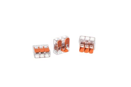 Set of transparent triple installation terminal blocks, isolated on white backgroundの写真素材