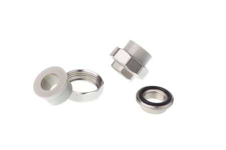 Disassembled plastic PPR straight metal thread coupling for water pipes, isolated on white backgroundの写真素材