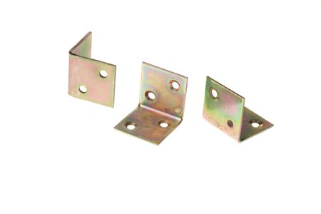 Set of metal alloy 90 degree angle fixating bracket, isolated on white backgroundの写真素材