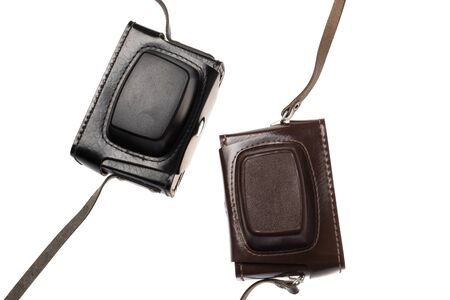 Vintage retro brown and black leather closed camera cases, isolated on white backgroundの写真素材
