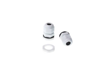 Small cable glands for automation panel connection, isolated on white backgroundの写真素材