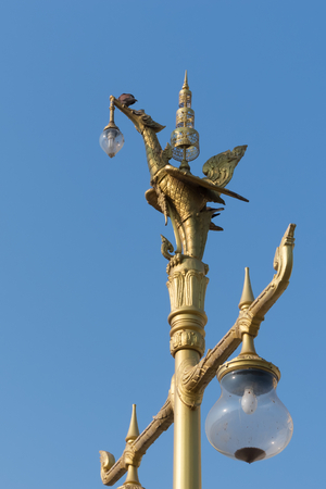 Lamp standing on the top of a swan.の写真素材