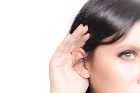Woman listening closelyの写真素材