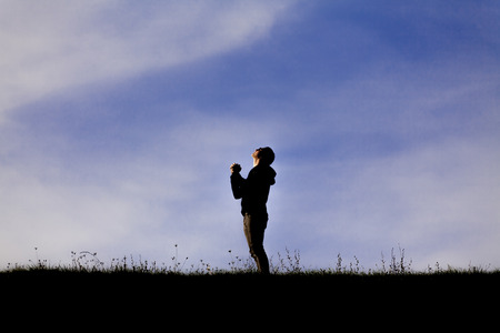 Man praying outsideの写真素材