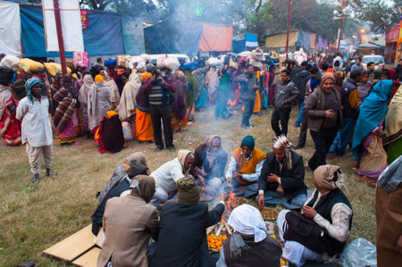 BABUGHAT, KOLKATA, WEST BENGAL   INDIA - 9TH JANUARY 2013   Hindu devotees lighting a camp fire on 9th January, 2013 at Babughat Camp, Kolkata  Every year many devotees from all over India reaches Babughat and camp there on their way to reach Gangasagar  のeditorial素材