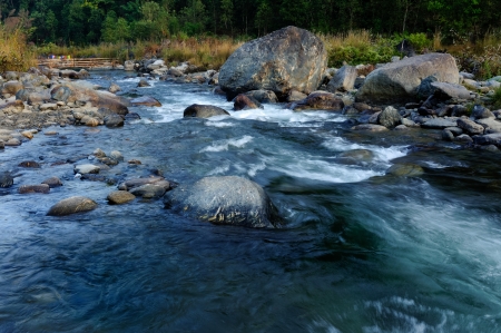 Reshi River water flowing on rocks at dawn,  Sikkim, Indiaの写真素材